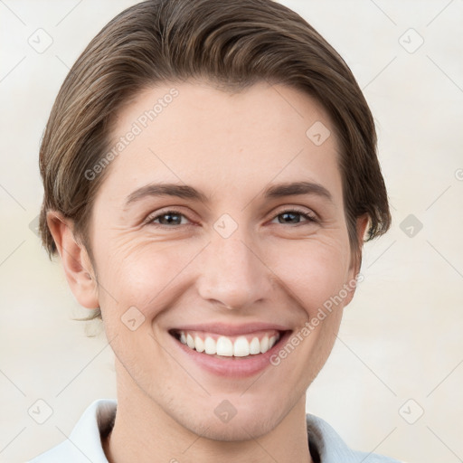 Joyful white young-adult female with short  brown hair and grey eyes