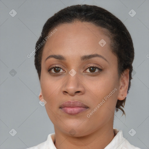 Joyful latino young-adult female with short  brown hair and brown eyes