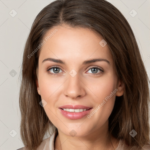 Joyful white young-adult female with medium  brown hair and green eyes