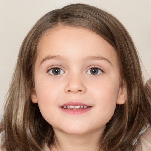 Joyful white child female with medium  brown hair and brown eyes