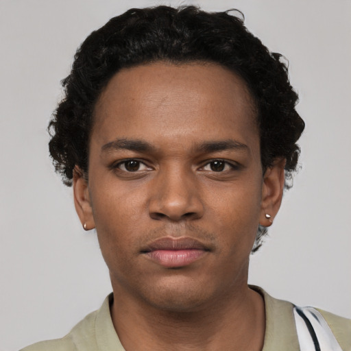 Neutral black young-adult male with short  black hair and brown eyes
