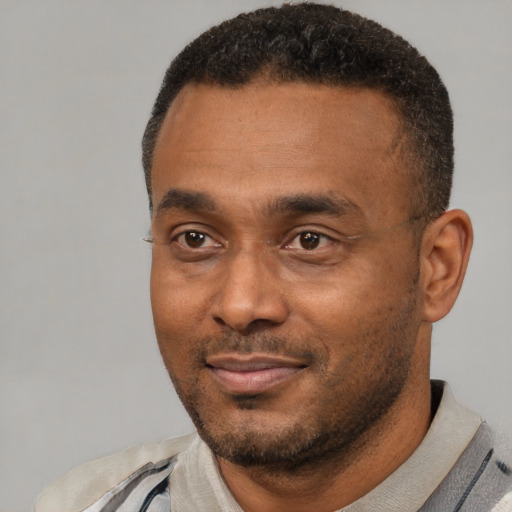 Neutral latino adult male with short  black hair and brown eyes