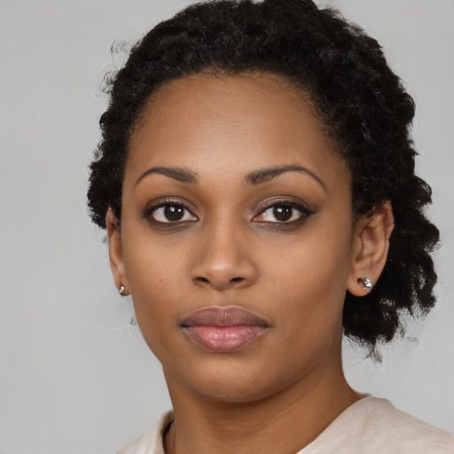 Neutral black young-adult female with short  black hair and brown eyes