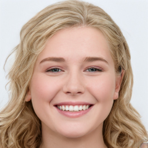 Joyful white young-adult female with long  brown hair and green eyes