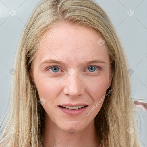 Joyful white adult female with long  brown hair and blue eyes