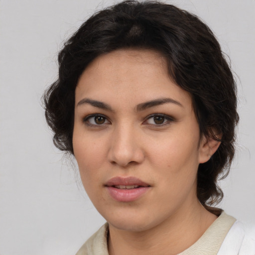 Joyful asian young-adult female with medium  brown hair and brown eyes