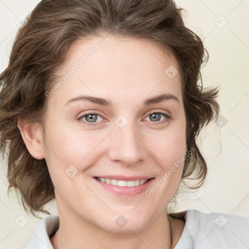 Joyful white young-adult female with medium  brown hair and green eyes