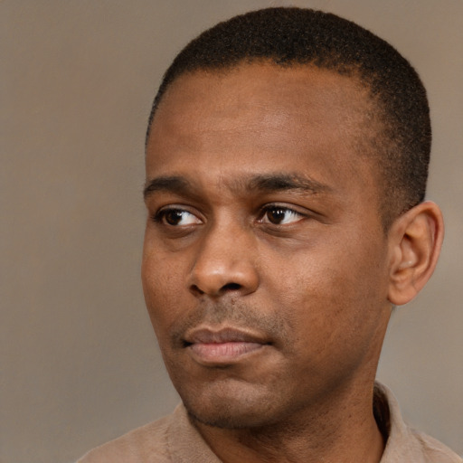 Neutral black young-adult male with short  black hair and brown eyes