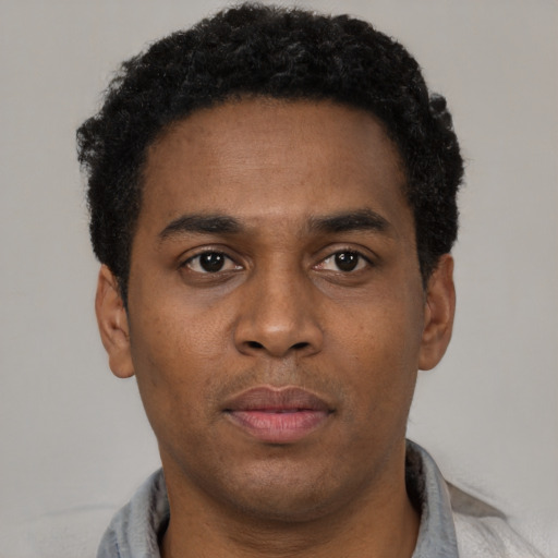 Neutral black young-adult male with short  brown hair and brown eyes