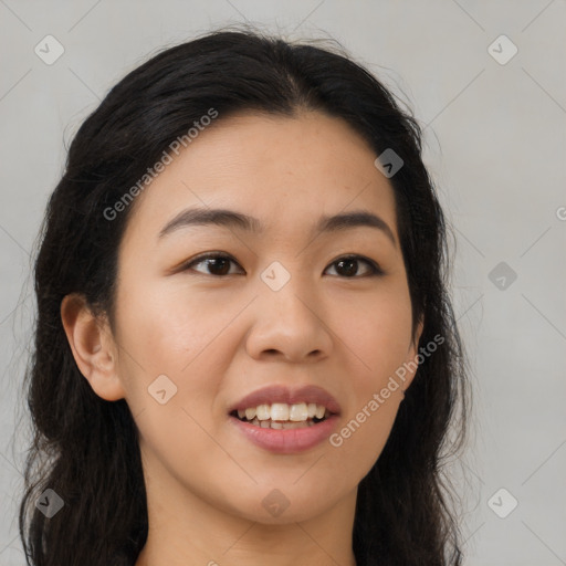 Joyful asian young-adult female with long  brown hair and brown eyes