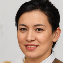 Joyful white adult female with medium  brown hair and brown eyes