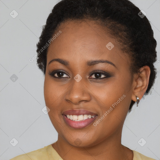 Joyful black young-adult female with short  brown hair and brown eyes