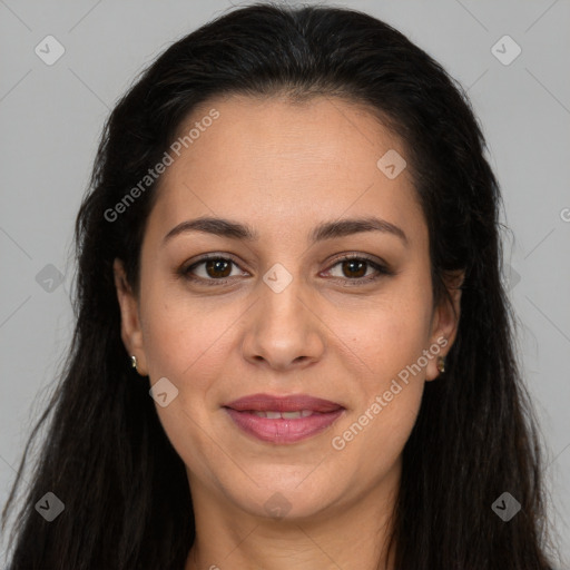 Joyful white adult female with long  brown hair and brown eyes