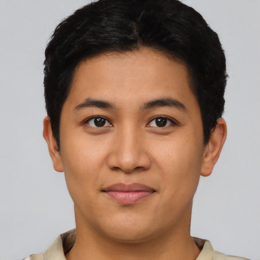 Joyful asian young-adult male with short  brown hair and brown eyes