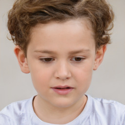 Joyful white child male with short  brown hair and brown eyes