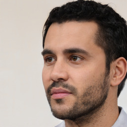 Neutral white young-adult male with short  black hair and brown eyes