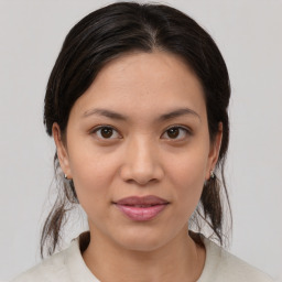 Joyful white young-adult female with medium  brown hair and brown eyes