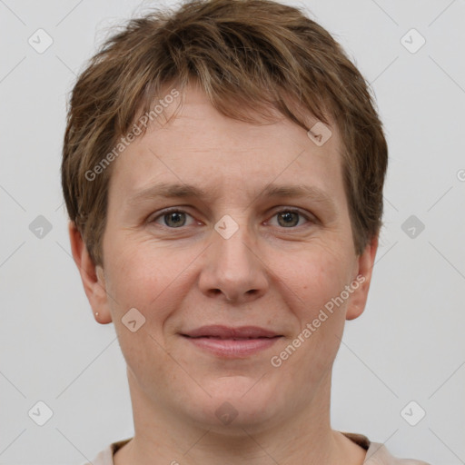 Joyful white adult male with short  brown hair and grey eyes