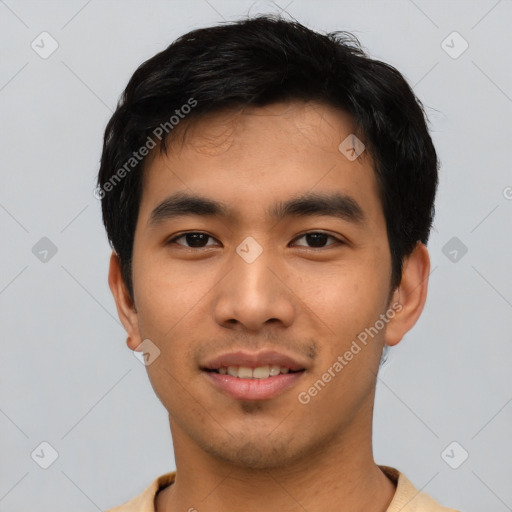 Joyful asian young-adult male with short  black hair and brown eyes