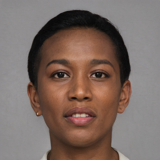 Joyful black young-adult female with short  brown hair and brown eyes