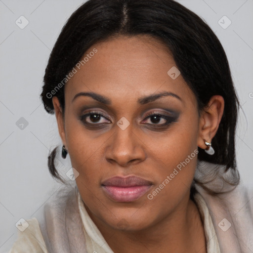 Joyful black young-adult female with medium  brown hair and brown eyes