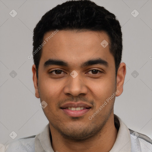 Joyful latino young-adult male with short  black hair and brown eyes