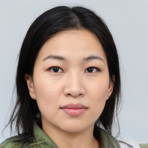 Neutral asian young-adult female with medium  brown hair and brown eyes