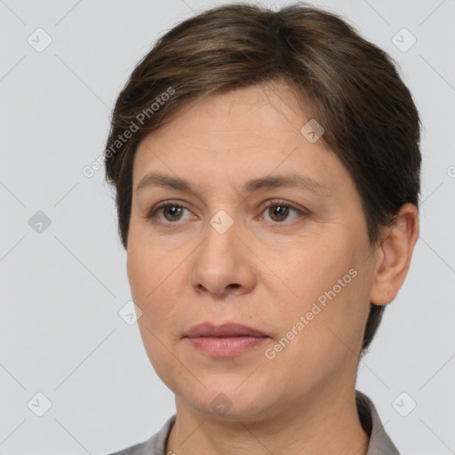 Joyful white adult female with short  brown hair and brown eyes