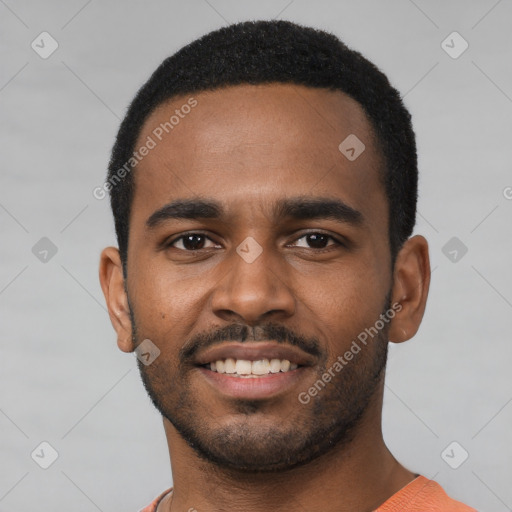 Joyful black young-adult male with short  black hair and brown eyes