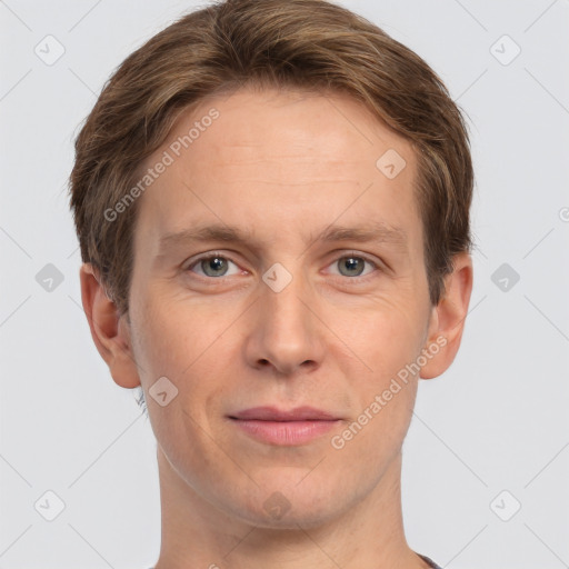 Joyful white adult male with short  brown hair and grey eyes