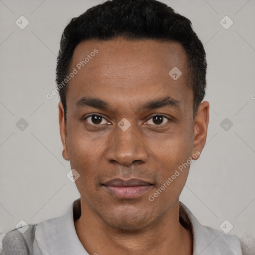 Joyful black young-adult male with short  black hair and brown eyes