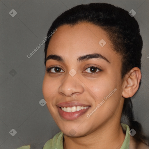 Joyful latino young-adult female with short  black hair and brown eyes