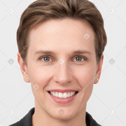 Joyful white young-adult female with short  brown hair and grey eyes