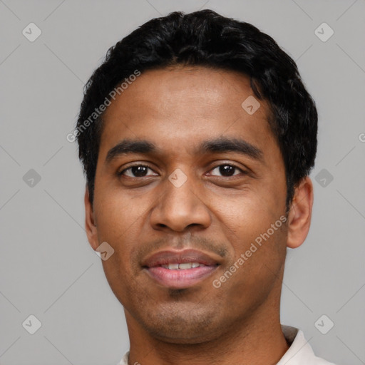 Joyful latino young-adult male with short  black hair and brown eyes