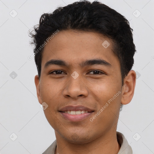 Joyful latino young-adult male with short  brown hair and brown eyes