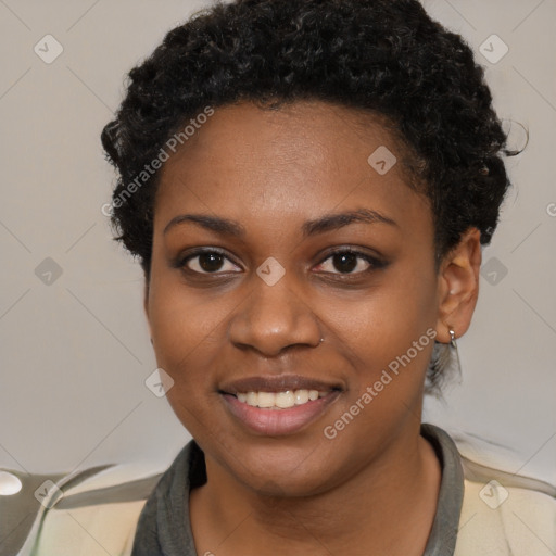 Joyful black young-adult female with short  black hair and brown eyes