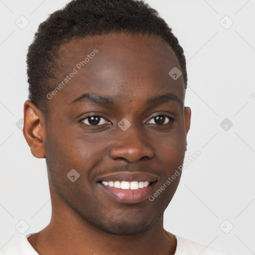 Joyful black young-adult male with short  brown hair and brown eyes