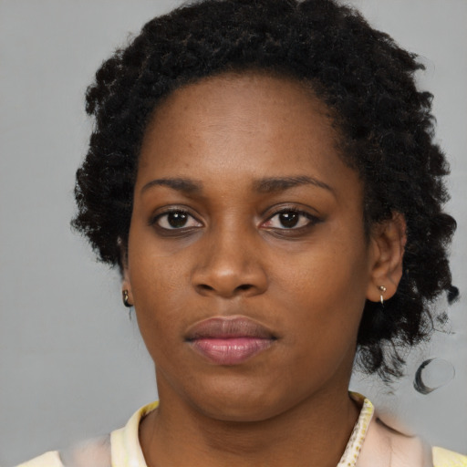 Neutral black young-adult female with short  brown hair and brown eyes