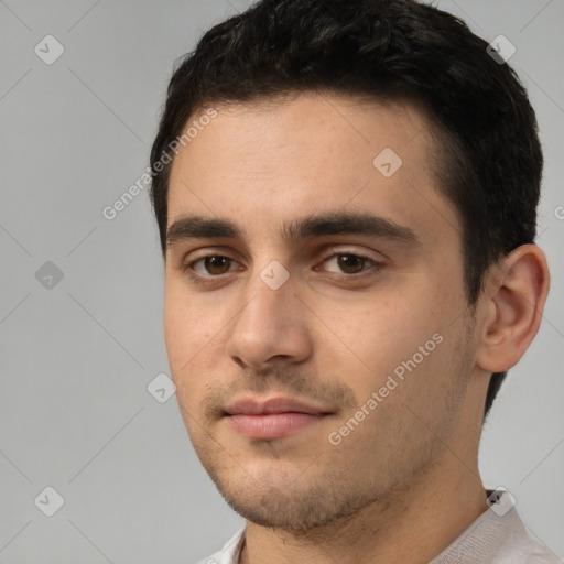 Neutral white young-adult male with short  black hair and brown eyes