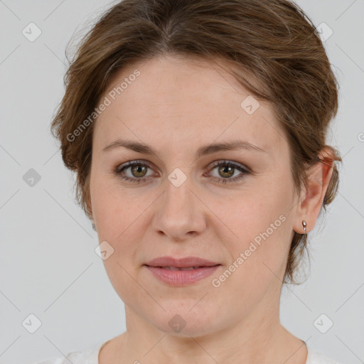 Joyful white young-adult female with medium  brown hair and green eyes