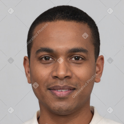 Joyful black young-adult male with short  black hair and brown eyes