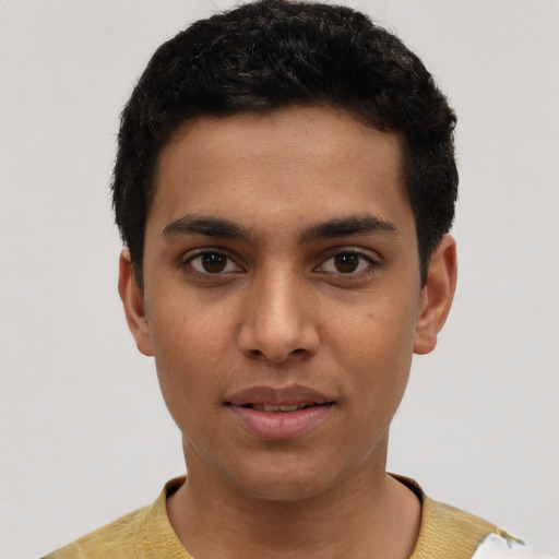 Joyful latino young-adult male with short  black hair and brown eyes