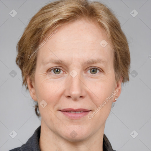 Joyful white adult female with medium  brown hair and grey eyes