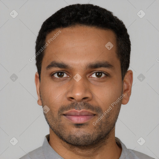 Neutral latino young-adult male with short  black hair and brown eyes