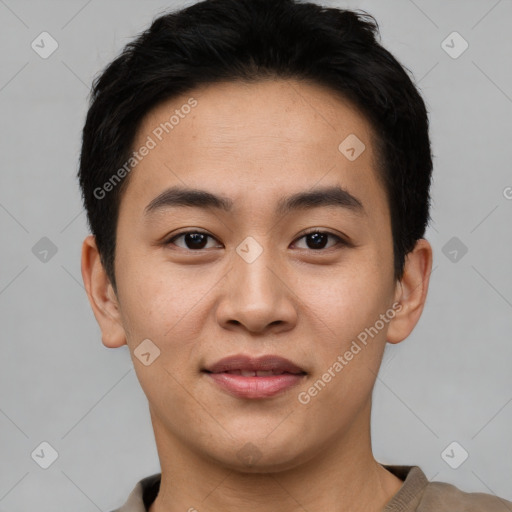 Joyful asian young-adult male with short  brown hair and brown eyes