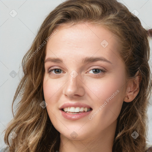 Joyful white young-adult female with long  brown hair and green eyes