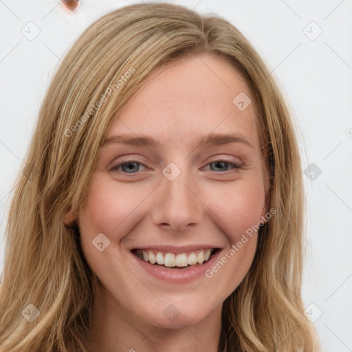 Joyful white young-adult female with long  brown hair and blue eyes