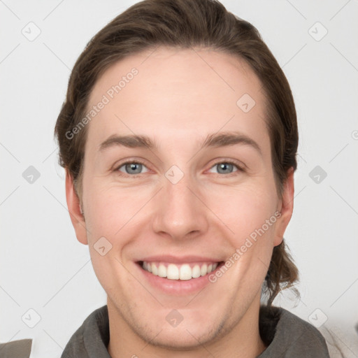 Joyful white young-adult female with short  brown hair and grey eyes