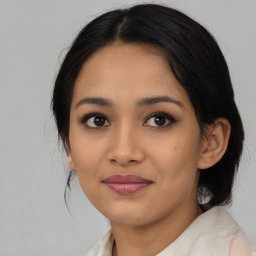 Joyful asian young-adult female with medium  black hair and brown eyes