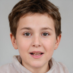 Joyful white child male with short  brown hair and brown eyes